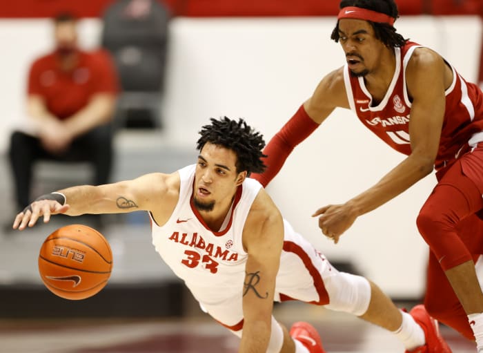 January 16, 2021, Alabama basketball forward James Rojas dives for a loose ball against Arkansas in Tuscaloosa, AL.